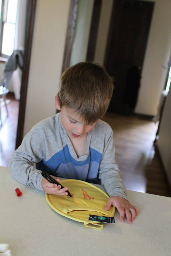 drawing a picture on a pot holder